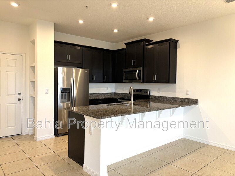 Stunning 3 BR/2.5BA Townhome in Gated Randal Walk with Water Views & 2-Car Garage! property image
