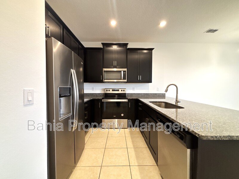 Stunning 3 BR/2.5BA Townhome in Gated Randal Walk with Water Views & 2-Car Garage! property image