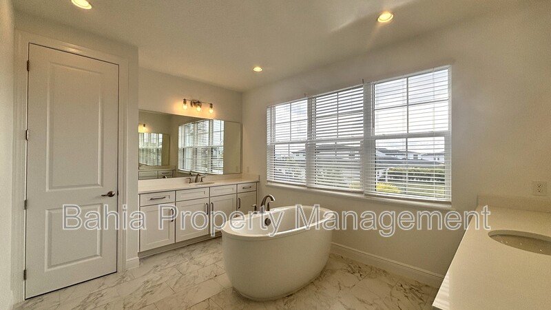 Stunning Lake Nona Luxury Home | 5 Bed, 4.5 Bath, 3-Car Garage, Pond Views & Resort Amenities property image